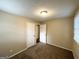 This bedroom has carpeted floors, neutral-colored walls and an closet at 3332 Ruby H Harper Se Blvd, Atlanta, GA 30354
