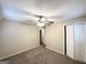 This bedroom features carpet, a ceiling fan and access to closet at 3332 Ruby H Harper Se Blvd, Atlanta, GA 30354