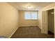 Cozy bedroom with neutral walls, window and plush carpeting at 3332 Ruby H Harper Se Blvd, Atlanta, GA 30354