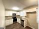 Modern kitchen with stainless steel appliances, granite countertops, and white cabinets at 3332 Ruby H Harper Se Blvd, Atlanta, GA 30354