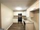 Well-lit kitchen featuring stainless steel appliances, stylish countertops, and white cabinets at 3332 Ruby H Harper Se Blvd, Atlanta, GA 30354