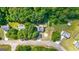 Aerial view of the home showcasing the surrounding lush green trees and neighborhood layout at 127 Muirwood Dr, Temple, GA 30179