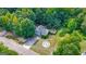 Aerial view of the house showing landscaping, backyard, driveway, and neighboring homes at 127 Muirwood Dr, Temple, GA 30179