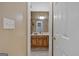 Bathroom sink featuring rustic wood drawers and a light countertop at 127 Muirwood Dr, Temple, GA 30179