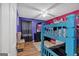 Brightly painted bedroom with laminate flooring and blue bunk beds at 127 Muirwood Dr, Temple, GA 30179
