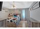 Cozy bedroom with ceiling fan, hardwood floors, and decorative wall accents at 127 Muirwood Dr, Temple, GA 30179