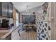 Unique dining area features chalkboard wall, picnic table, and custom painted refrigerator at 127 Muirwood Dr, Temple, GA 30179