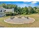 Beautifully designed fire pit area with seating, perfect for outdoor gatherings at 127 Muirwood Dr, Temple, GA 30179