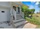 Inviting front porch with steps and a white railing, adding curb appeal to the home at 127 Muirwood Dr, Temple, GA 30179