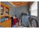 Bonus room featuring an exposed ceiling, treadmill, and storage cabinet at 127 Muirwood Dr, Temple, GA 30179