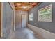 Bonus room with chalkboard wall, laminate floors, and access to the outdoors at 127 Muirwood Dr, Temple, GA 30179