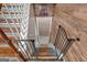 Stairway featuring wood and carpet steps and wooden railings at 127 Muirwood Dr, Temple, GA 30179