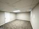 Finished basement area with neutral walls and carpet, and a window at 3995 Willowbrook Dr, Douglasville, GA 30135