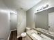 Renovated bathroom with granite vanity top, new fixtures, framed mirror, and a walk-in shower with tile surround at 3995 Willowbrook Dr, Douglasville, GA 30135