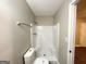 Bathroom featuring a toilet and shower with neutral paint and ceiling at 3995 Willowbrook Dr, Douglasville, GA 30135