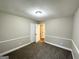 Inviting bedroom with neutral paint, carpet, and a view into the hall, providing a serene atmosphere at 3995 Willowbrook Dr, Douglasville, GA 30135
