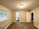 Neutral carpeted bedroom with a window and a door leading to a bathroom at 3995 Willowbrook Dr, Douglasville, GA 30135