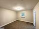 Bedroom features neutral walls, carpet and a window adding natural light at 3995 Willowbrook Dr, Douglasville, GA 30135