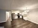Modern kitchen features stainless appliances, granite countertops, white cabinets, and luxury vinyl plank flooring at 3995 Willowbrook Dr, Douglasville, GA 30135