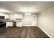 Bright kitchen with white cabinetry, stainless appliances, granite countertops, and modern light fixture at 3995 Willowbrook Dr, Douglasville, GA 30135