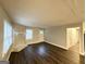 Comfortable living room with luxury vinyl plank flooring, stone fireplace, and large window for ample light at 3995 Willowbrook Dr, Douglasville, GA 30135