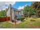 A spacious backyard boasts a patio with an outdoor dining area, a fire pit, and a trampoline at 2060 Lake St, Loganville, GA 30052