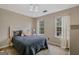 Cozy bedroom features plush bedding, natural light from windows, and modern light fixture at 2060 Lake St, Loganville, GA 30052