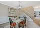 Elegant dining room with a stylish chandelier and seating for four at 2060 Lake St, Loganville, GA 30052