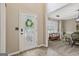 Inviting foyer featuring wood floors and a decorative glass front door at 2060 Lake St, Loganville, GA 30052