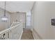 Hallway with staircase and modern light fixture for cozy look at 2060 Lake St, Loganville, GA 30052