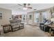 Spacious living room with a ceiling fan, plush carpet, and comfortable furniture at 2060 Lake St, Loganville, GA 30052