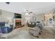 Inviting living room with brick fireplace and neutral carpeting and furnishings at 2060 Lake St, Loganville, GA 30052
