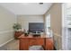Functional office space with a wooden desk, providing a quiet workspace at 2060 Lake St, Loganville, GA 30052