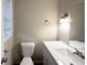 Bathroom featuring a light vanity, large mirror, modern fixtures and neutral walls at 2610 Preston Dr, Decatur, GA 30034