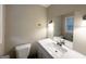 Bathroom with a light vanity, large mirror, modern fixtures and neutral walls at 2610 Preston Dr, Decatur, GA 30034