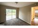 Comfortable bedroom featuring a sliding glass door to the backyard and neutral carpeting at 2610 Preston Dr, Decatur, GA 30034