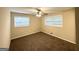Bedroom featuring a ceiling fan, neutral walls, brown carpet and bright natural light at 2610 Preston Dr, Decatur, GA 30034