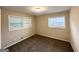 Bedroom with neutral walls, brown carpet and bright natural light coming in through windows at 2610 Preston Dr, Decatur, GA 30034