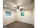 Bedroom with neutral walls, carpet, ceiling fan and plenty of natural light at 2930 Waters Rd, Atlanta, GA 30354
