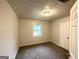 Cozy bedroom with a neutral color scheme and a window at 2930 Waters Rd, Atlanta, GA 30354