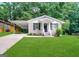 Charming brick home with a well-maintained lawn and a convenient carport at 2930 Waters Rd, Atlanta, GA 30354