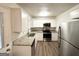 Well-equipped kitchen featuring granite countertops, stainless steel appliances, and white cabinetry at 2930 Waters Rd, Atlanta, GA 30354