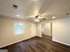 Inviting living room featuring hardwood floors, ceiling fan, and natural light at 2930 Waters Rd, Atlanta, GA 30354