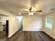 Bright living room featuring hardwood floors, a ceiling fan, and neutral paint at 2930 Waters Rd, Atlanta, GA 30354