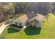 Aerial view of the charming home with a stone accent wall and long driveway at 425 Wendy Ct, Mcdonough, GA 30252
