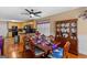 A dining room connects to an open-concept kitchen with black appliances and an island at 425 Wendy Ct, Mcdonough, GA 30252
