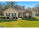 Charming single-story home featuring a stone accent wall and a well-maintained lawn at 425 Wendy Ct, Mcdonough, GA 30252