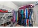 Walk-in closet featuring metal shelving units and clothing hanging on racks at 425 Wendy Ct, Mcdonough, GA 30252