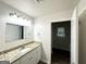 Bathroom featuring a granite vanity and modern fixtures, with a view into the shower/tub at 660 Thomasville Se Blvd, Atlanta, GA 30315
