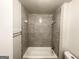 Updated bathroom featuring modern bathtub with a shower and updated shower walls at 660 Thomasville Se Blvd, Atlanta, GA 30315